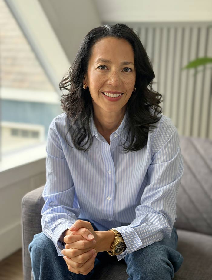 A compassionate infertility therapist providing emotional support for infertility during a consultation in a calm office setting.
