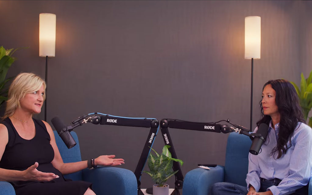 Host Lana Doan and reproductive counsellor Darcy Thachuk sitting together in a professional studio, engaged in a compassionate and honest conversation about the emotional complexities of fertility journeys.
